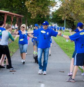 Crossing the finish line last year with Lenore (at an MND  fundraiser event).